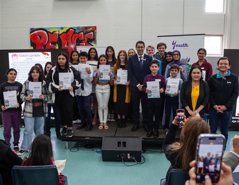 Group photo of Mayor with young people and their certificates