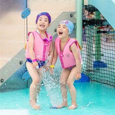 two children playing in water