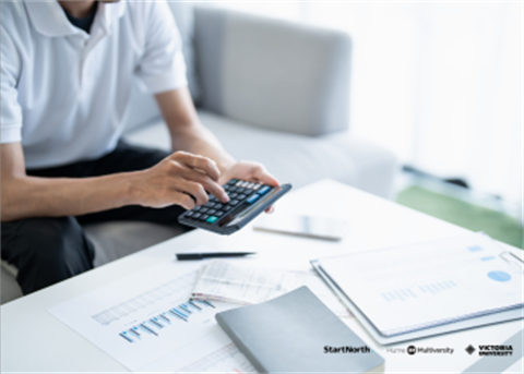 person holding a calculator 