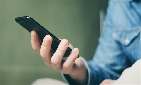 close-up of a person holding a mobile phone