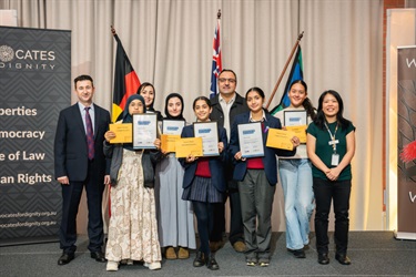Children receiving award on stage 
