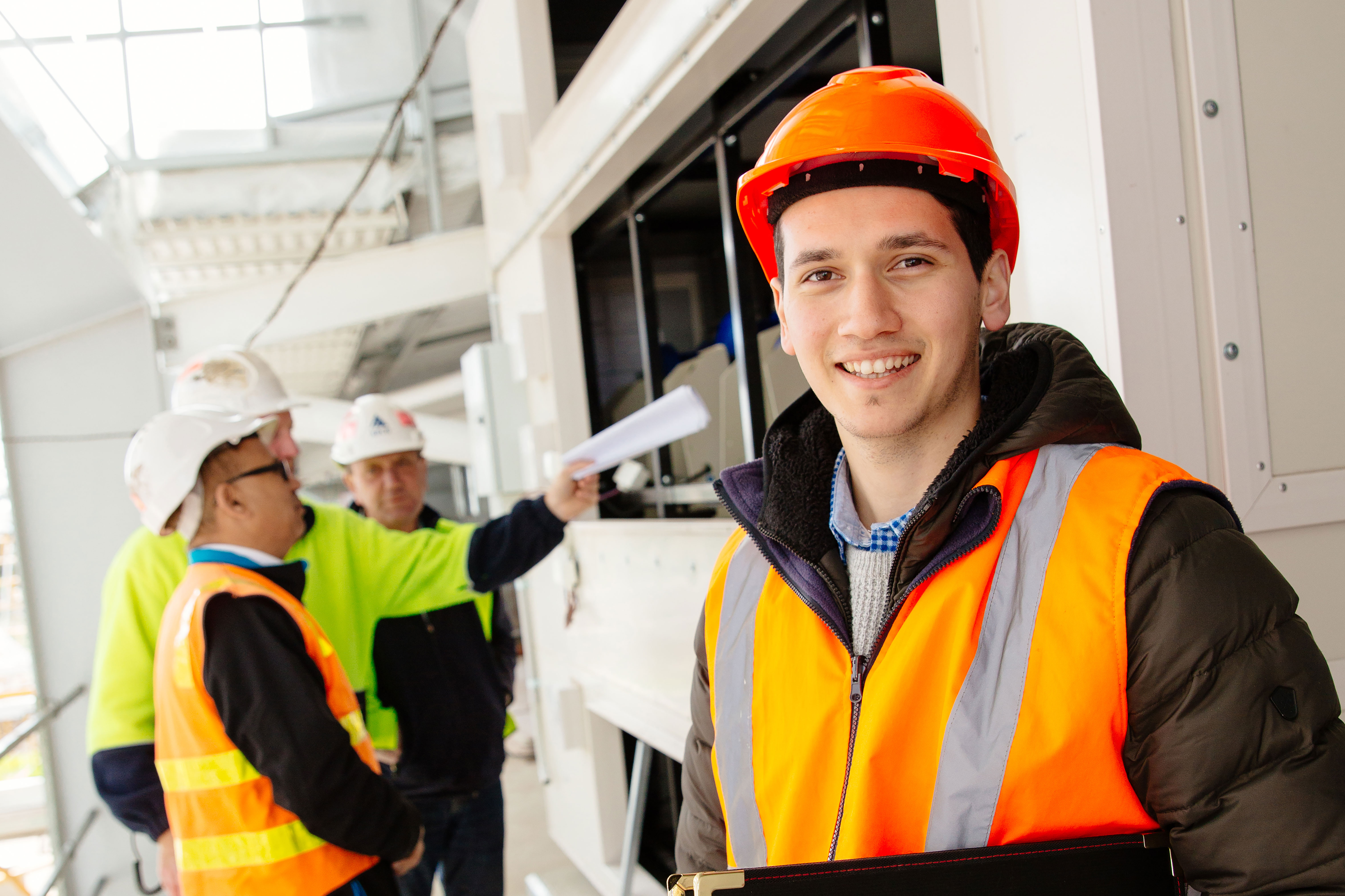 people-smiling-at-construction-site_pexels.jpg
