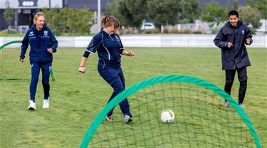 Women playing soccer